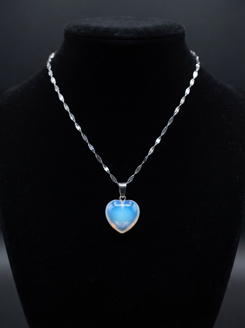 Heart-shaped Opal charm with stylized Chain."